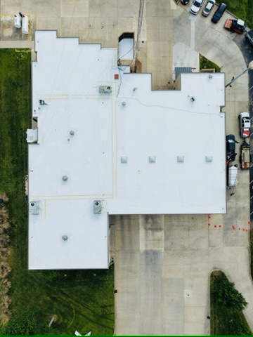 Aerial survey of a fully coated commercial roof
