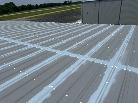 Metal panel seams sealed and coated