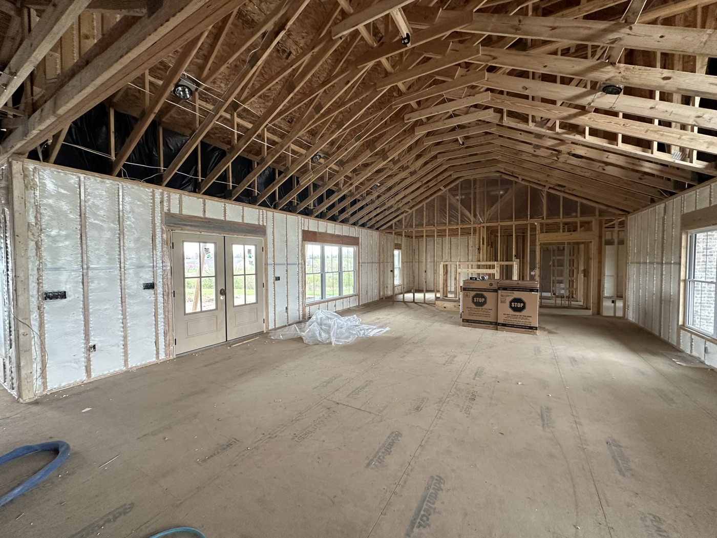 Closed-cell spray foam applied to interior walls and roof deck